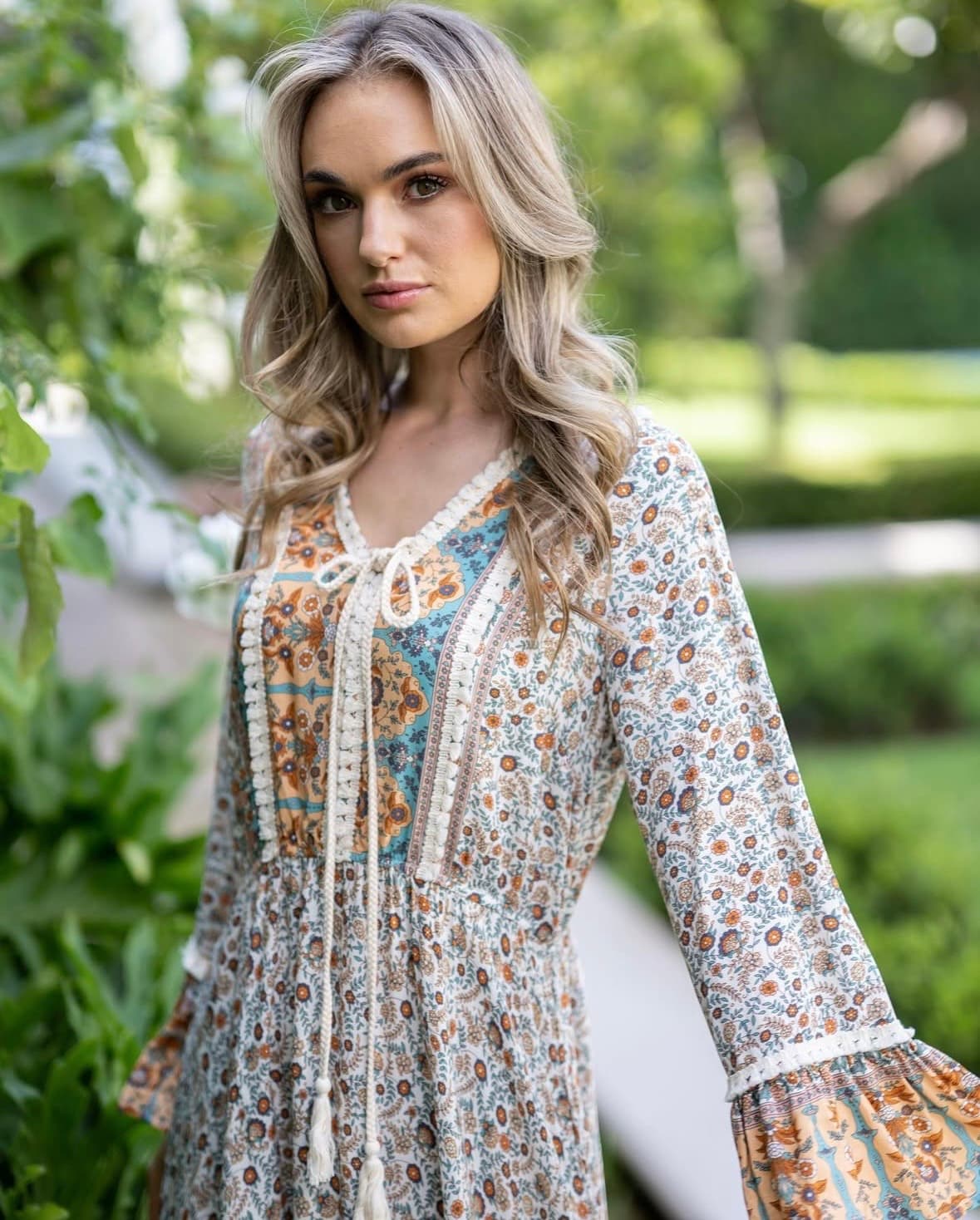 Floral v neck maxi dress with tassel and fringe detailing. So pretty and has a slight fluted sleeve. - Image 2