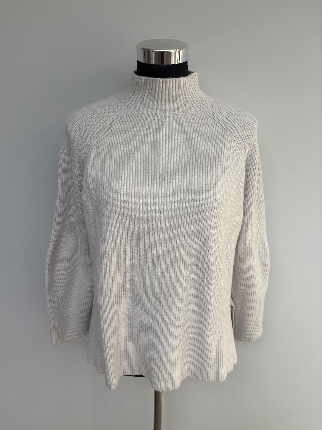Cream ribbed knit with a mock neck with a small slit hem. Viscose blend . - Image 3