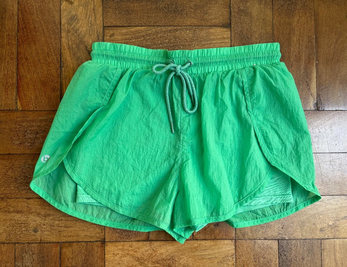 Apple green gym shorts with inner shorts and an Elasticated tie waist. 