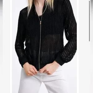Black soft slightly shiny mesh bomber jacket. 