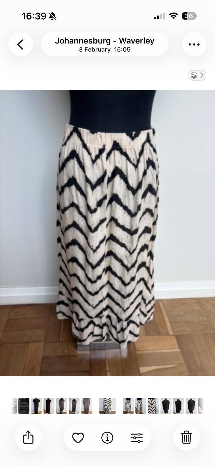 Cream and blk printed maxi skirt with an Elasticated waistband by a s African woman’s brand . - Image 2