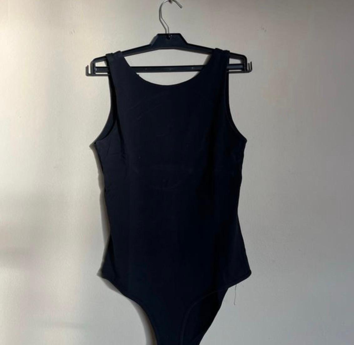 Women’s black top with low back